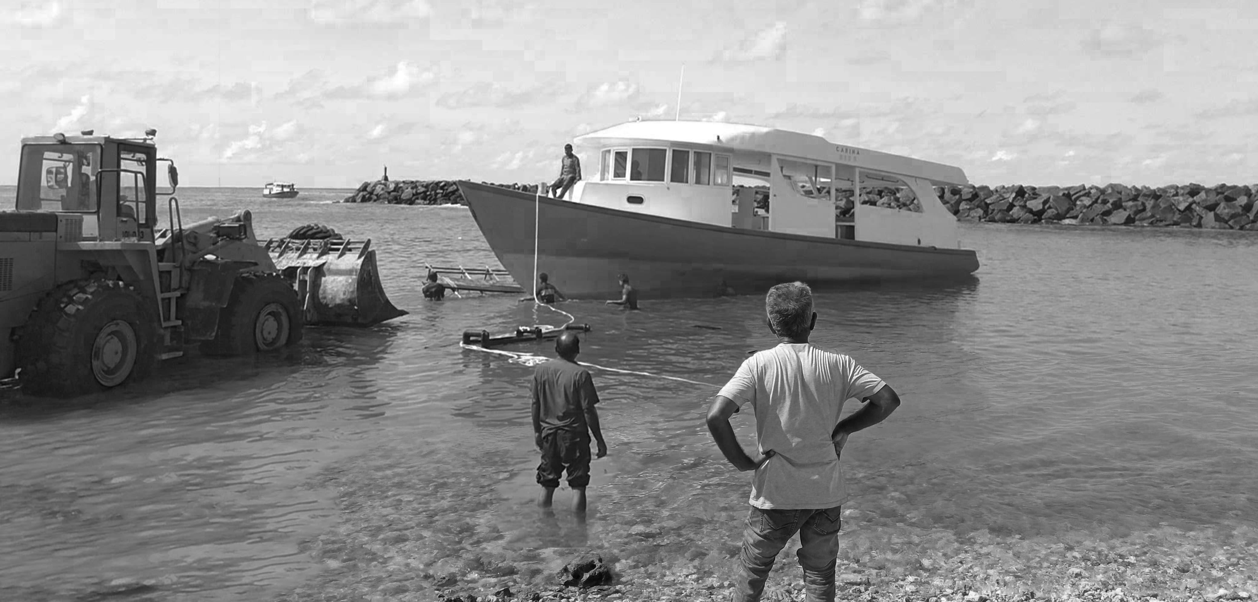 Launching a diving boat using an excavator