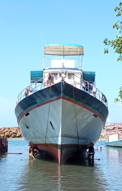 Large fishing vessel being hauled-out